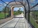 Enclosed bike path with view of building and palm trees at 4137 Woodview Dr, Sarasota, FL 34232