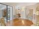 View of eat in kitchen with decorative chairs, access to the kitchen, and large glass doors leading outside at 4137 Woodview Dr, Sarasota, FL 34232