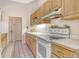 Well-maintained kitchen with white countertops, ample cabinet space, and modern appliances at 4137 Woodview Dr, Sarasota, FL 34232