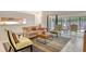 Comfortable living area with stylish furnishings and sliding glass doors that provide lots of natural light at 4137 Woodview Dr, Sarasota, FL 34232
