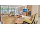 Comfortable living room featuring tile floors, modern entertainment center, and sliding glass doors to an outdoor space at 4137 Woodview Dr, Sarasota, FL 34232