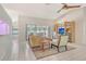 Bright and open living room featuring an entertainment center, seamless access to a screened patio, and tile flooring at 4137 Woodview Dr, Sarasota, FL 34232