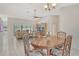 Open-concept living space featuring neutral walls, modern furniture, and sliding glass doors to the outdoor patio at 4137 Woodview Dr, Sarasota, FL 34232