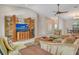 Spacious living room with a large media center, ceiling fan, and a comfortable seating area at 4137 Woodview Dr, Sarasota, FL 34232