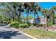 Entrance sign for Woodland Park, a quiet residential community surrounded by lush trees at 4137 Woodview Dr, Sarasota, FL 34232