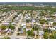 An aerial view of a well-maintained residential neighborhood with mature trees and spacious lots at 4222 Lanai Dr, Sarasota, FL 34241