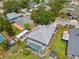 Aerial view of a home showcasing a screened-in pool, RV parking, and well-maintained landscaping at 4222 Lanai Dr, Sarasota, FL 34241