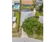 Aerial view showcases a home with mature trees, screened in pool, spacious yard, and RV parking at 4222 Lanai Dr, Sarasota, FL 34241