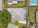 Aerial view of a home with a screened pool, well-kept backyard, RV parking, and mature landscaping at 4222 Lanai Dr, Sarasota, FL 34241