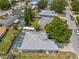 Aerial view of the home showing the screened-in pool and RV parking in a residential neighborhood at 4222 Lanai Dr, Sarasota, FL 34241