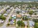 An aerial view of a residential neighborhood with mature trees, spacious lots, and well-maintained streets at 4222 Lanai Dr, Sarasota, FL 34241