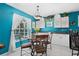 The dining area features a stylish table and chairs with a window providing natural light at 4222 Lanai Dr, Sarasota, FL 34241