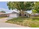 Charming home boasting a two-car garage, well-kept lawn, and meticulously landscaped front yard with mature trees at 4222 Lanai Dr, Sarasota, FL 34241