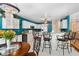 Open kitchen with white cabinets, counter seating, and stainless steel appliances at 4222 Lanai Dr, Sarasota, FL 34241