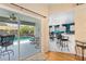 Patio doors open to a screened patio and pool area, next to the open kitchen at 4222 Lanai Dr, Sarasota, FL 34241