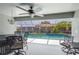 Relaxing screened-in patio overlooking a refreshing private pool with beautiful landscaping at 4222 Lanai Dr, Sarasota, FL 34241