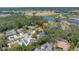 Aerial view of the property showing its location near a golf course and lake at 435 Whispering Oaks Ct, Sarasota, FL 34232