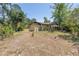 Private backyard oasis with lush landscaping, mature trees, and a serene setting providing a peaceful outdoor experience at 435 Whispering Oaks Ct, Sarasota, FL 34232