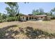 Expansive backyard featuring a patio area perfect for outdoor dining and entertaining at 435 Whispering Oaks Ct, Sarasota, FL 34232