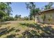Private backyard featuring lush greenery, providing a serene and secluded outdoor space at 435 Whispering Oaks Ct, Sarasota, FL 34232