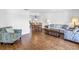 Inviting living room featuring hardwood floors, neutral decor, and ample natural light at 435 Whispering Oaks Ct, Sarasota, FL 34232