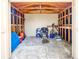 Inside the shed with a workbench, shelving, and space for storage at 435 Whispering Oaks Ct, Sarasota, FL 34232