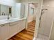 Bright bathroom with modern fixtures, a shower area, and convenient access to the laundry room at 4412 125Th W St, Cortez, FL 34215