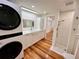 Well-equipped laundry room with modern machines, sink, and convenient access to the bathroom at 4412 125Th W St, Cortez, FL 34215