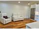 Cozy living room featuring white walls, modern furniture, and an open layout at 4412 125Th W St, Cortez, FL 34215