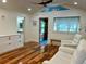 Inviting living room with wood floors, vaulted ceiling, and natural light at 4412 125Th W St, Cortez, FL 34215