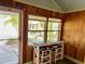Inviting porch with wood paneling, seating counter, and serene outdoor view at 4412 125Th W St, Cortez, FL 34215