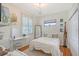 Cozy bedroom featuring a comfortable bed, natural light, and stylish decor at 4603 4Th E Ave, Bradenton, FL 34208