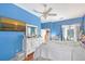 Spacious blue bedroom with a large window and a comfortable bed at 4603 4Th E Ave, Bradenton, FL 34208