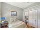 Relaxing bedroom featuring a bed, desk, and ample closet space at 4603 4Th E Ave, Bradenton, FL 34208