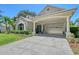 Beautiful single-story home with a porte-cochère, manicured lawn, and charming curb appeal at 4603 4Th E Ave, Bradenton, FL 34208