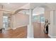 Open concept living room with wood floors, archways, and access to the outdoor pool area at 4603 4Th E Ave, Bradenton, FL 34208