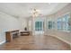 Bright living area with a fireplace, ceiling fan, and access to the outdoor space at 4603 4Th E Ave, Bradenton, FL 34208