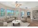 Bright living room with comfortable seating, a ceiling fan, and natural light at 4603 4Th E Ave, Bradenton, FL 34208