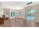 Spacious living area with hardwood floors, sliding glass doors and many windows at 4603 4Th E Ave, Bradenton, FL 34208