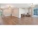 A large living room with hardwood floors, a ceiling fan, and a decorative fireplace at 4603 4Th E Ave, Bradenton, FL 34208