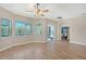 Living room featuring hardwood floors, large windows, and neutral paint at 4603 4Th E Ave, Bradenton, FL 34208