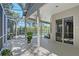 Screened outdoor patio featuring a pool, hot tub, and covered seating area at 4603 4Th E Ave, Bradenton, FL 34208