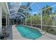 A screened pool and spa invite relaxation and rejuvenation in a private setting at 4603 4Th E Ave, Bradenton, FL 34208