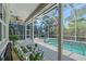 An outdoor living space featuring a screen-enclosed pool, hot tub and comfortable seating at 4603 4Th E Ave, Bradenton, FL 34208