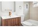 Bathroom featuring modern wood vanity, gold fixtures, sleek tiling, and contemporary design at 5045 10Th S Ave, Gulfport, FL 33707