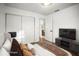 Bedroom featuring hardwood floors, ample storage, and modern, staged decor at 5045 10Th S Ave, Gulfport, FL 33707
