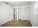 Bright bedroom features wood-look flooring, bi-fold closet doors and easy access to other rooms at 5045 10Th S Ave, Gulfport, FL 33707