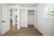 Bright room with closet and laundry; wood-look flooring at 5045 10Th S Ave, Gulfport, FL 33707