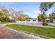 Inviting home showcasing a vibrant green lawn and traditional brick street at 5045 10Th S Ave, Gulfport, FL 33707