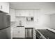 Modern kitchen with stainless steel appliances, quartz countertops, and stylish gold accents at 5045 10Th S Ave, Gulfport, FL 33707